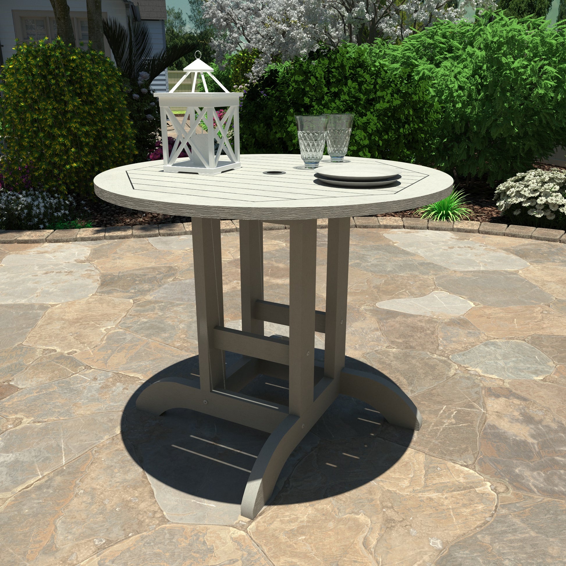 Light gray 36” diameter dining height table with lantern, plates, and glasses