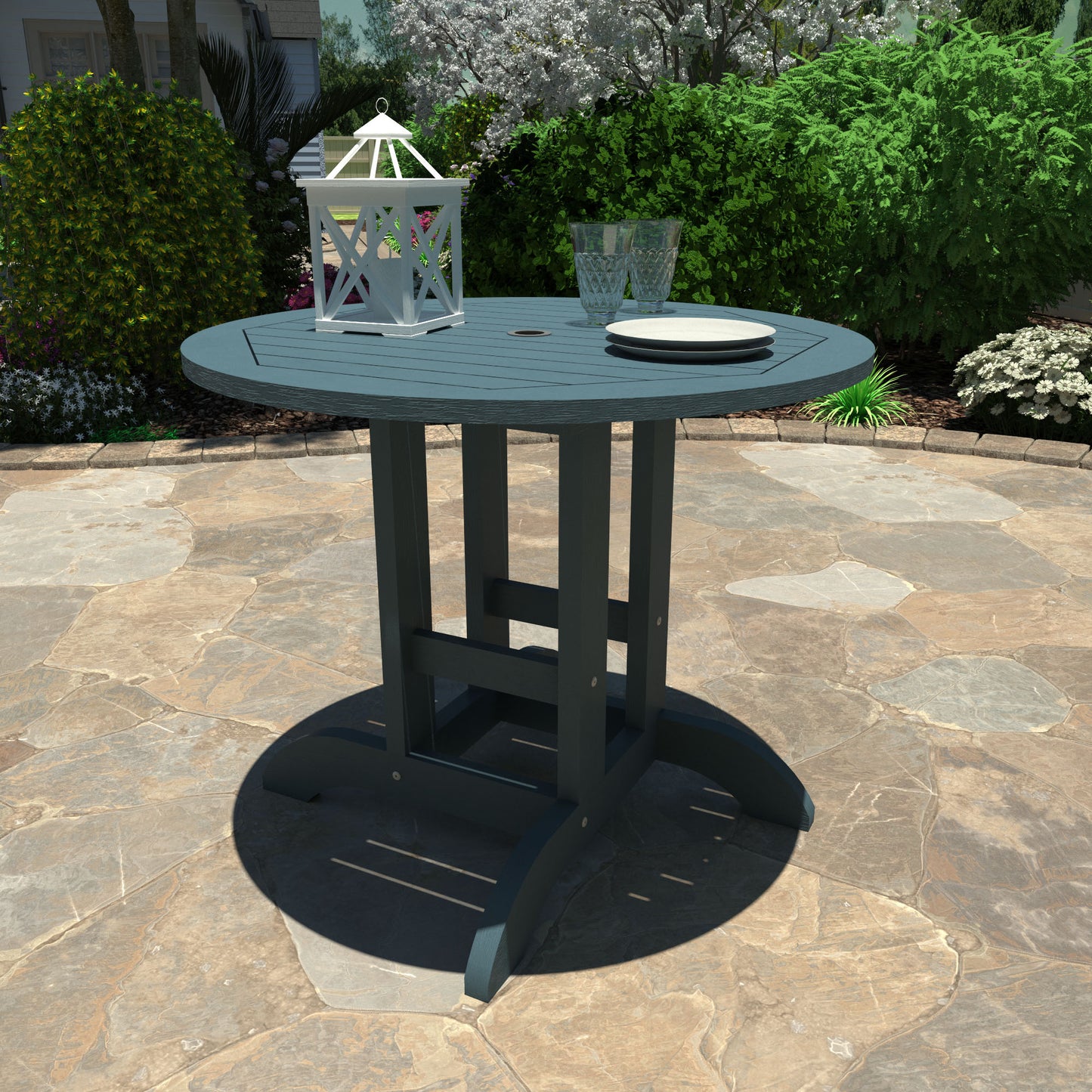 Light blue 36” diameter dining height table with lantern, plates, and glasses