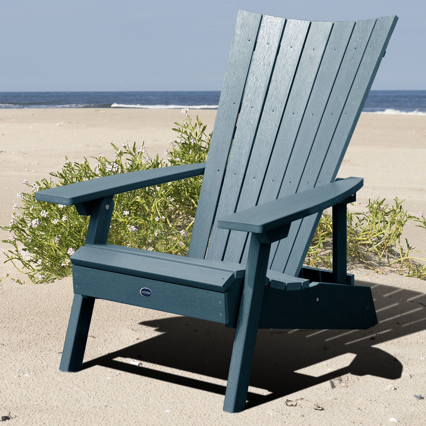 Blue Granite Hills folding and reclining Adirondack chair on a beach