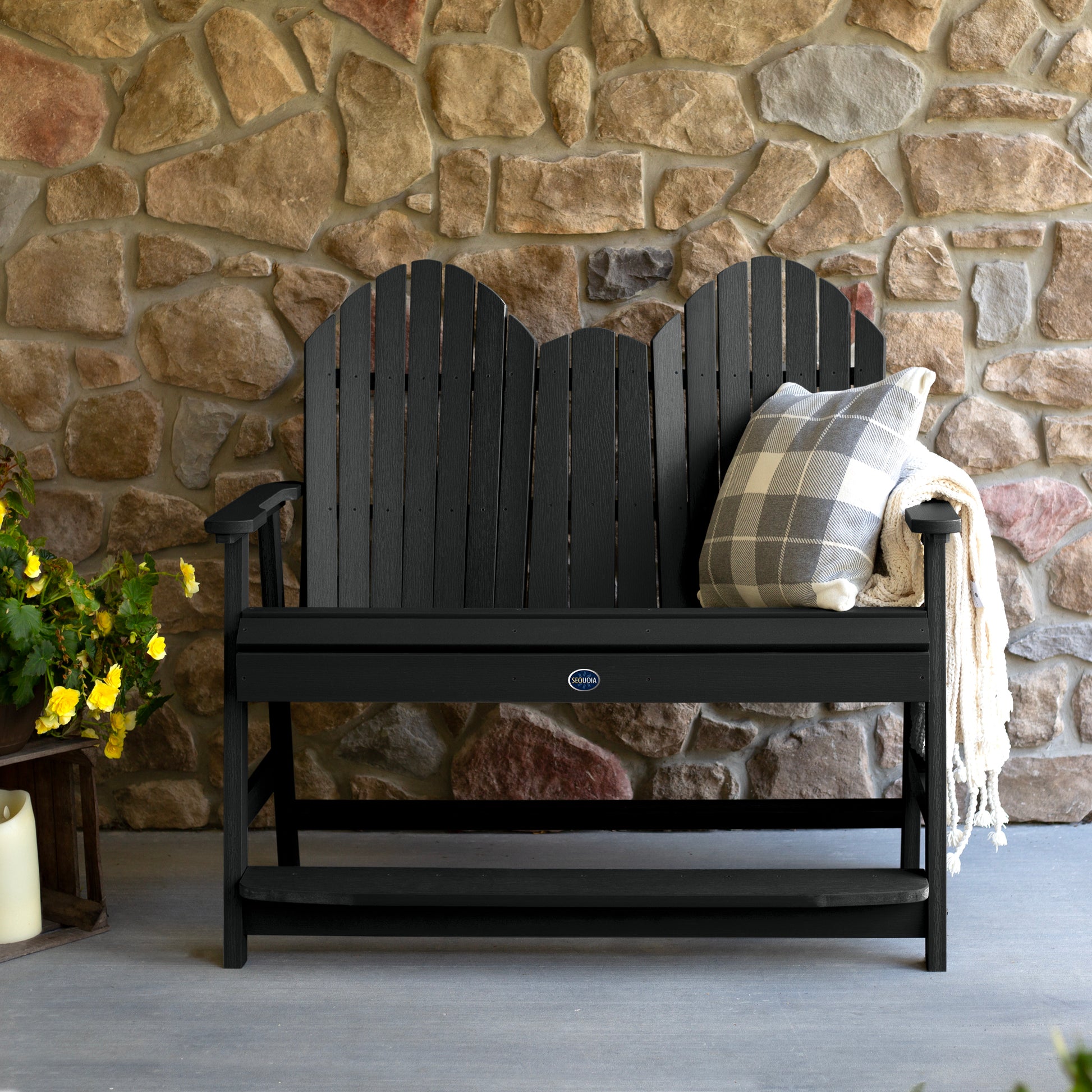 Black Lighthouse counter height Adirondack bench against stone wall