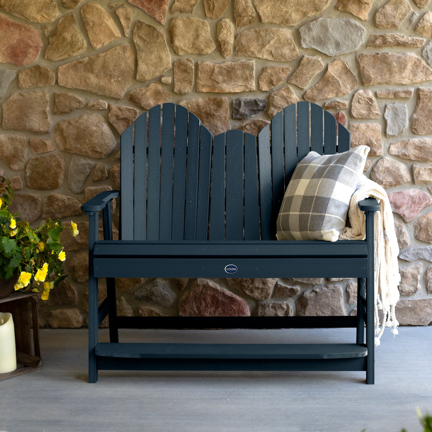 Dark blue Lighthouse counter height Adirondack bench against stone wall