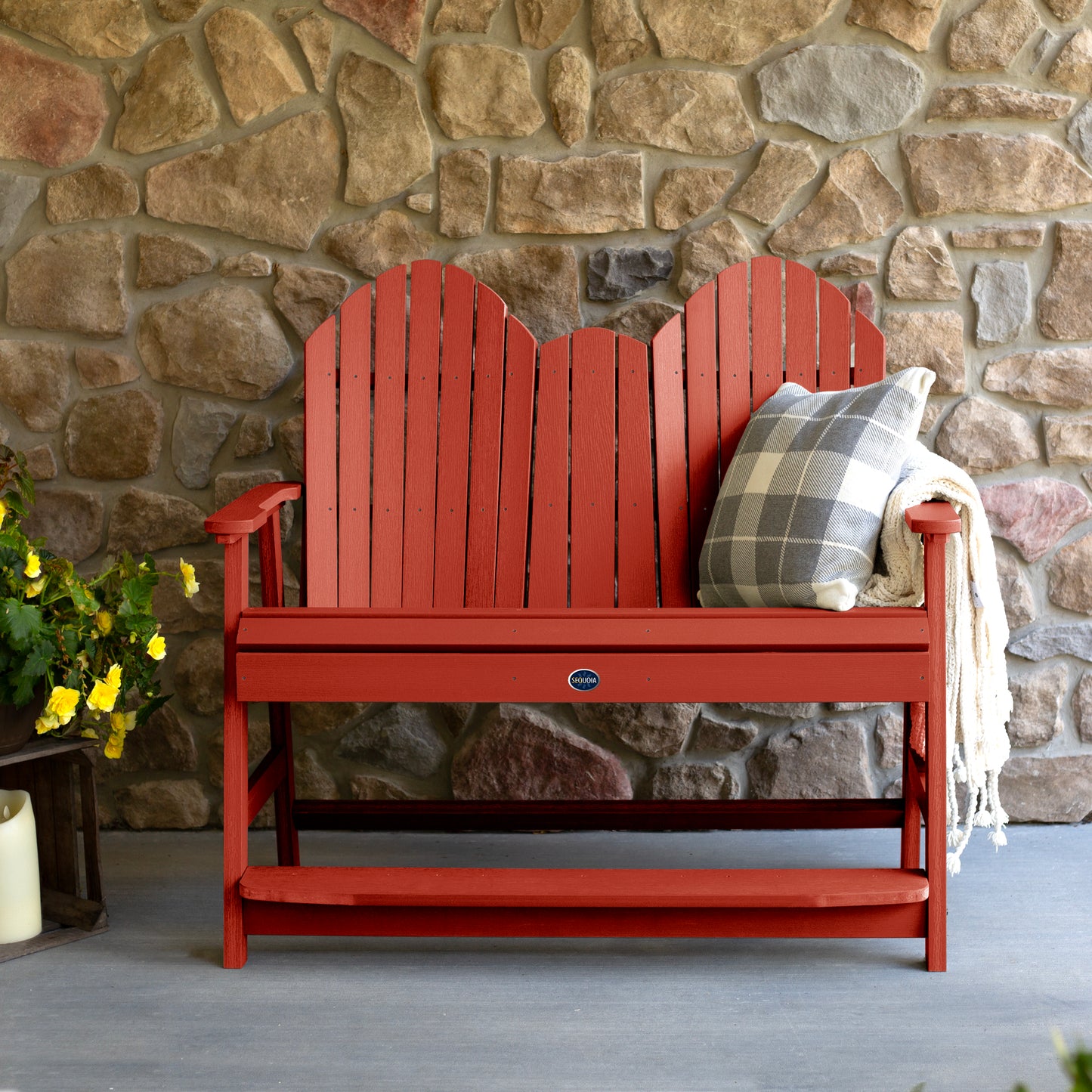 Red Lighthouse counter height Adirondack bench against stone wall
