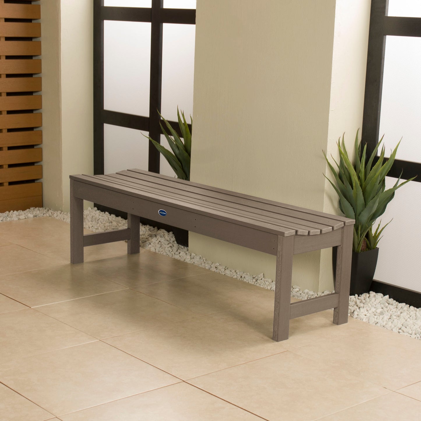 5ft light brown Blue Ridge backless bench in stone porch area