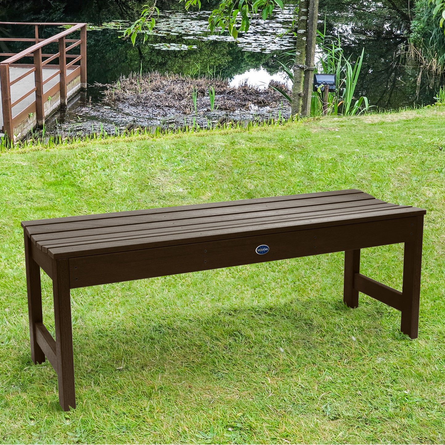 4ft brown Blue Ridge backless bench on grassy lawn