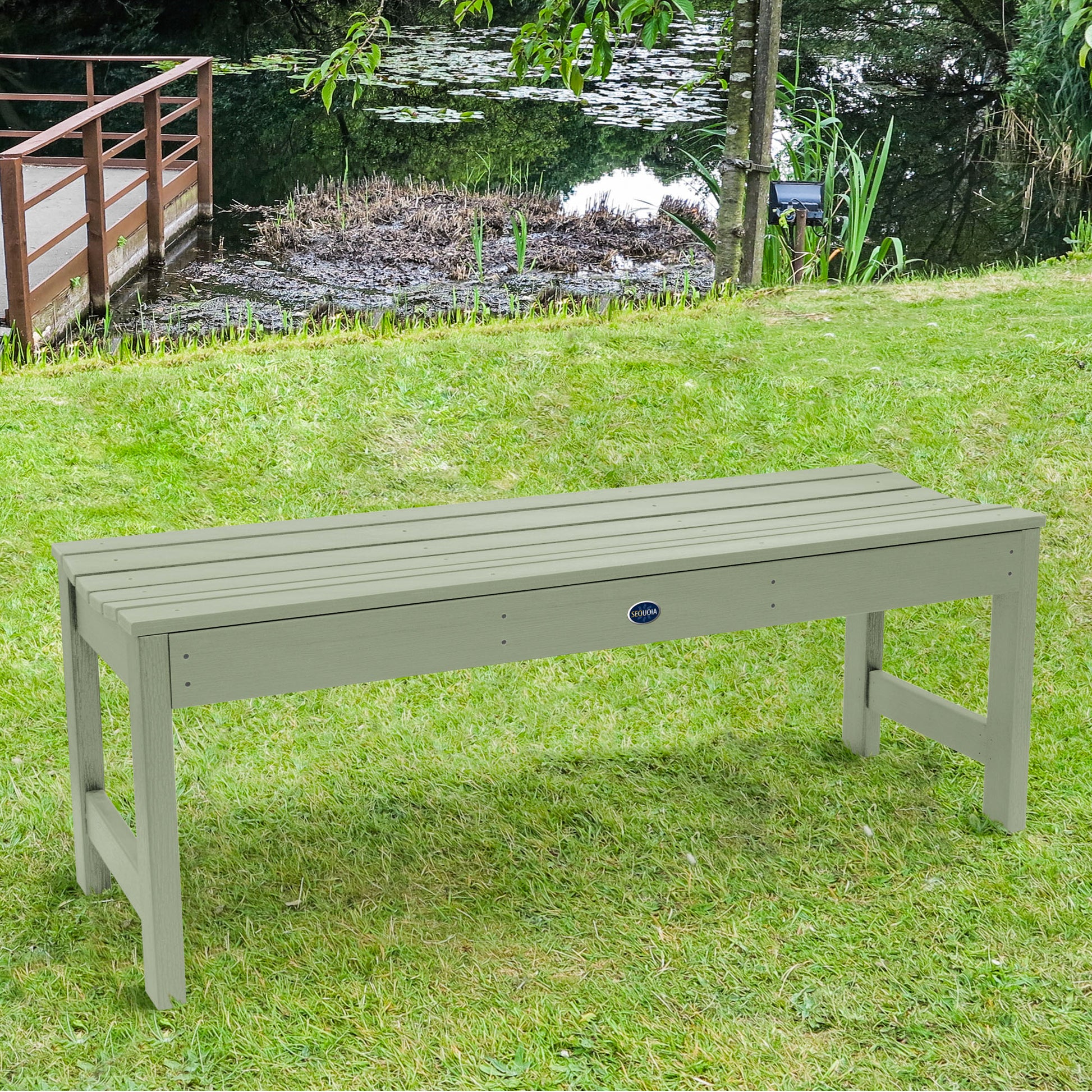 4ft light green Blue Ridge backless bench on grassy lawn