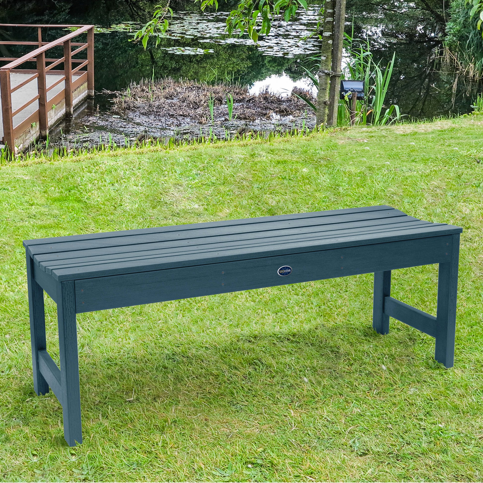 4ft light brown Blue Ridge backless bench on grassy lawn