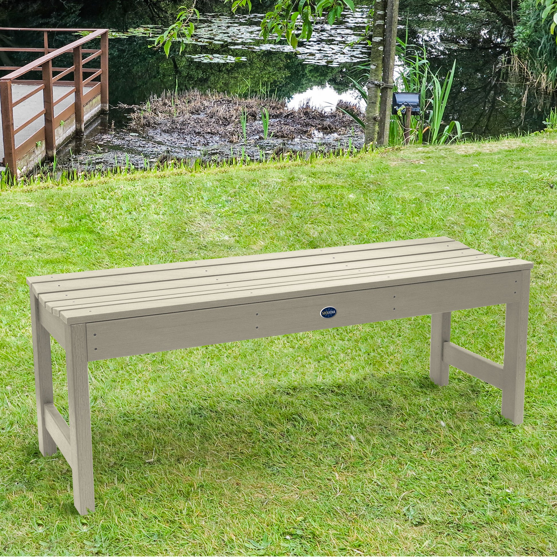 4ft Whitewash Blue Ridge backless bench on grassy lawn
