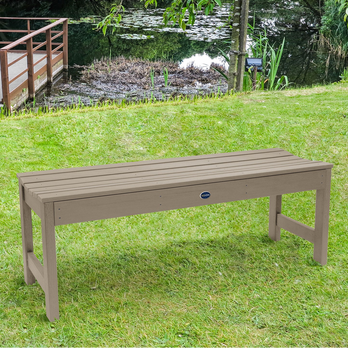 4ft light brown Blue Ridge backless bench on grassy lawn