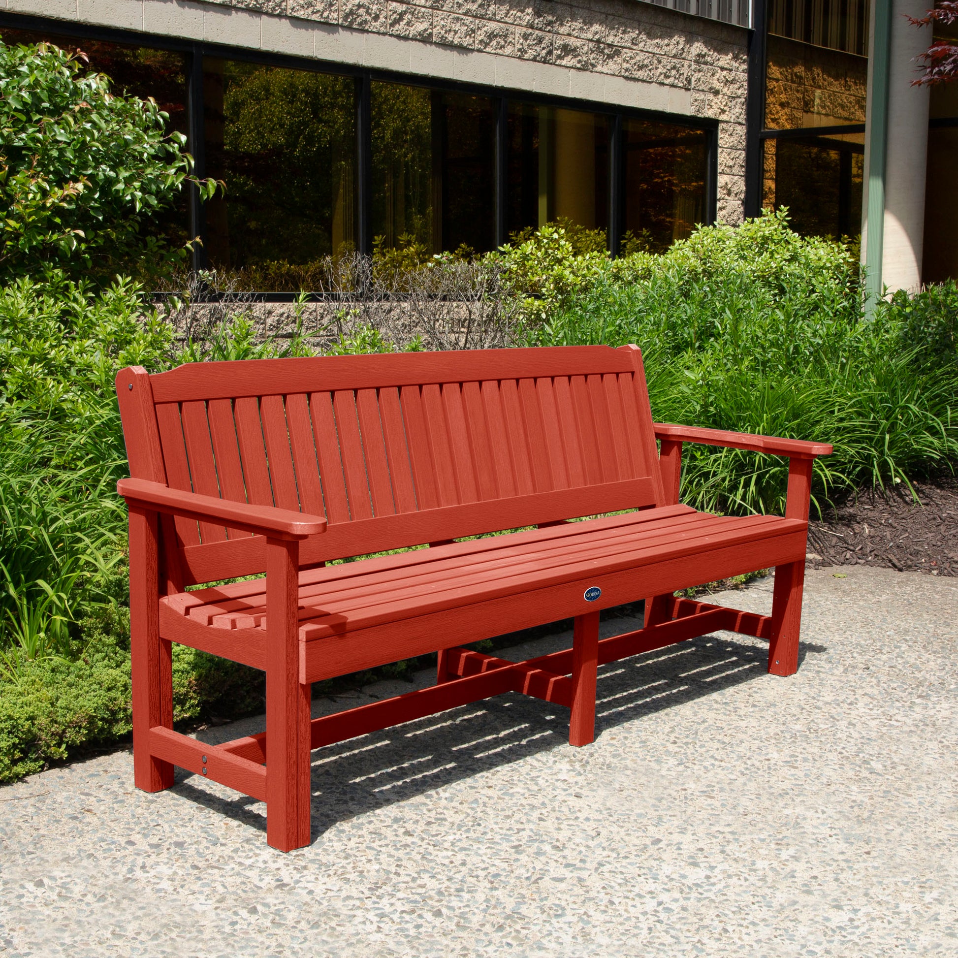 Red 6ft Blue Ridge Garden Bench with bushes in background
