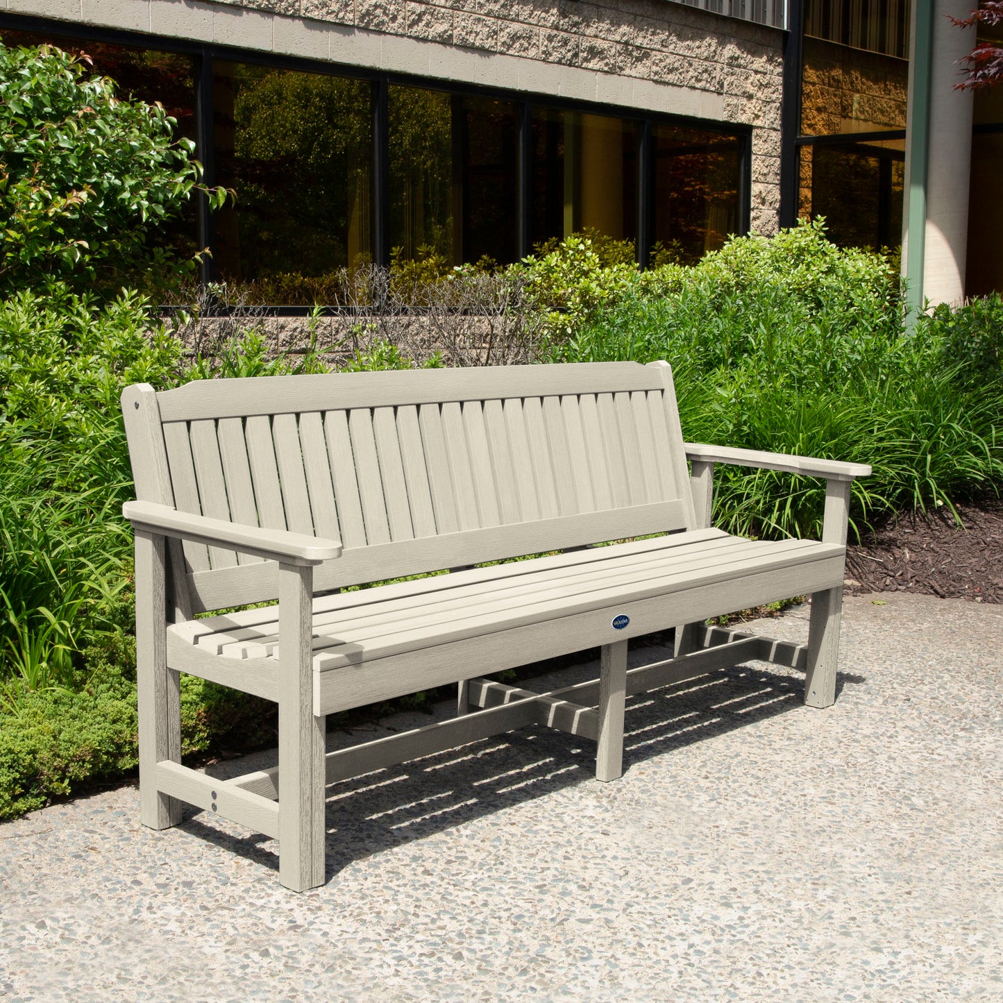 Whitewash 6ft Blue Ridge Garden Bench with bushes in background