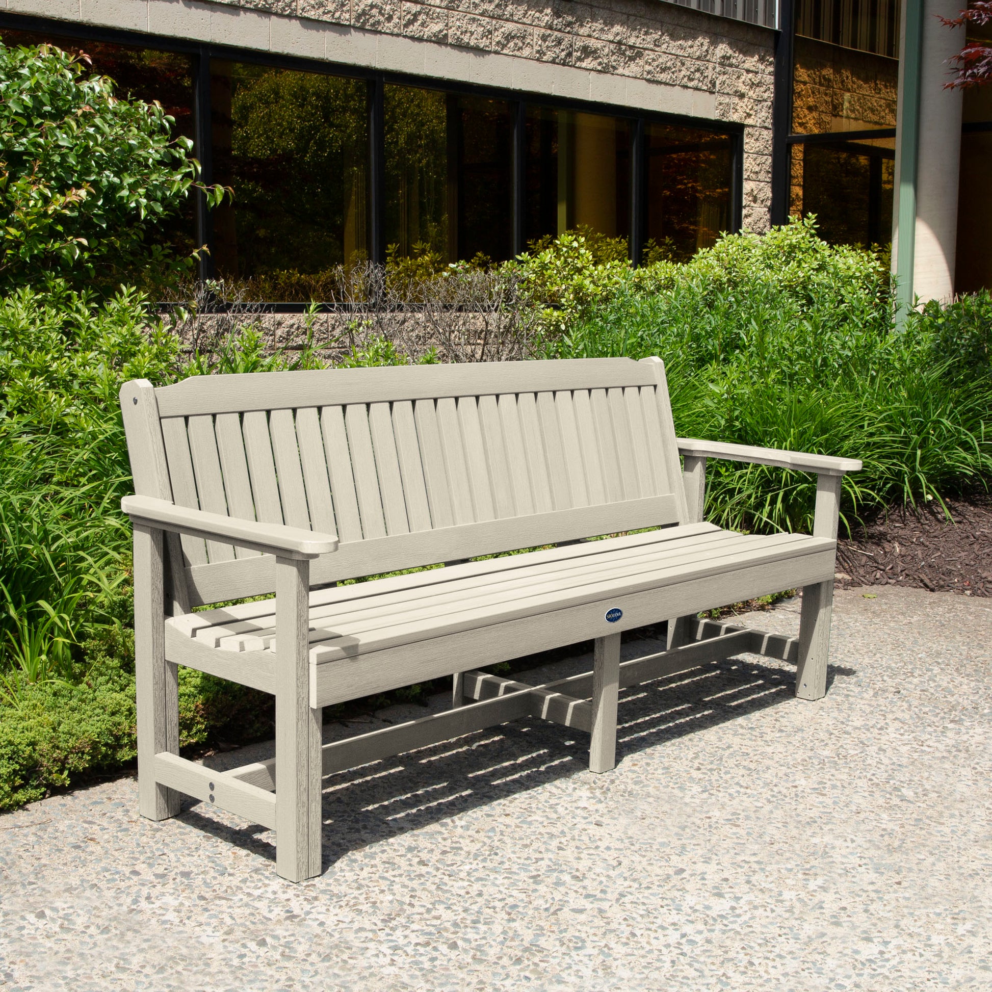 Whitewash 6ft Blue Ridge Garden Bench with bushes in background