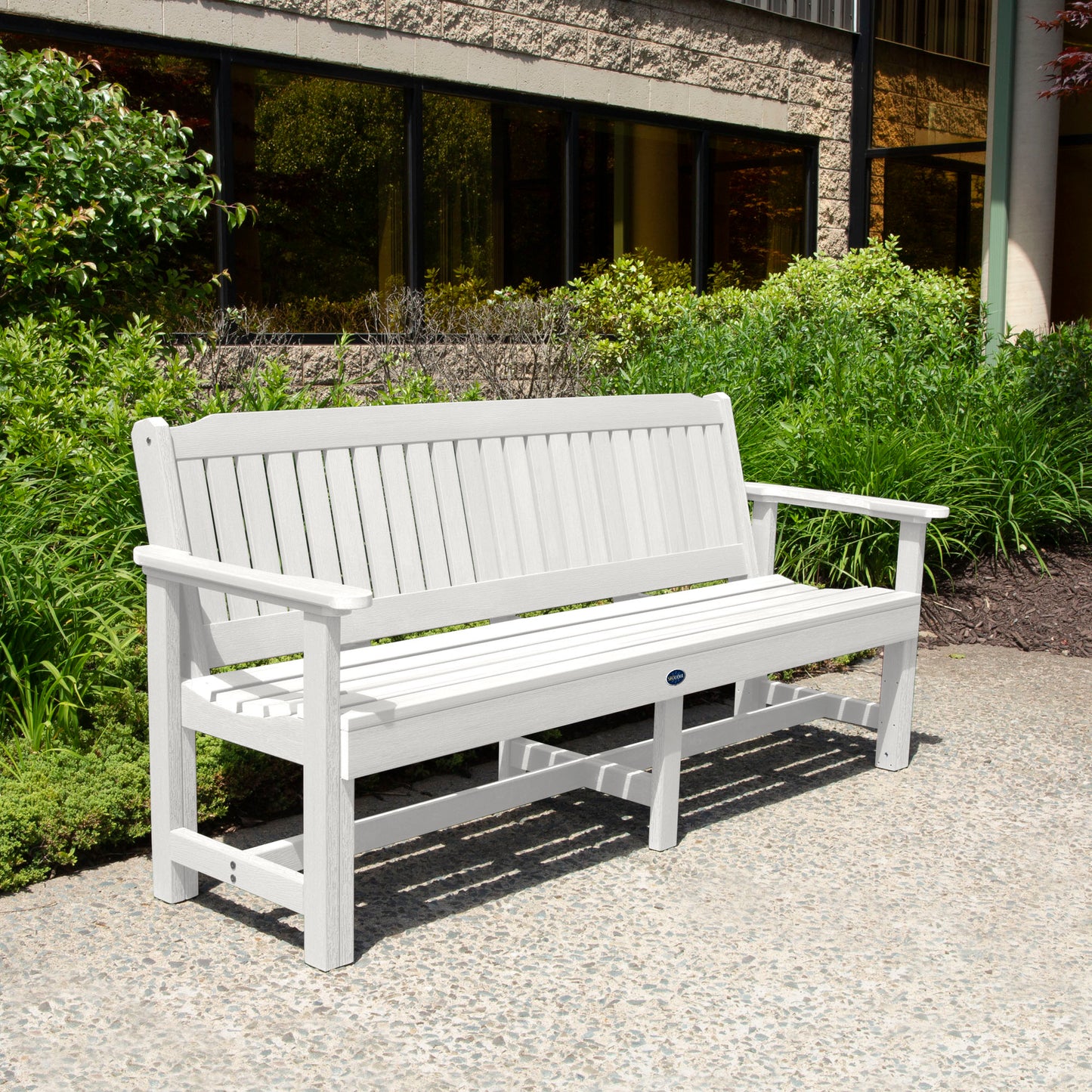 White 6ft Blue Ridge Garden Bench with bushes in background