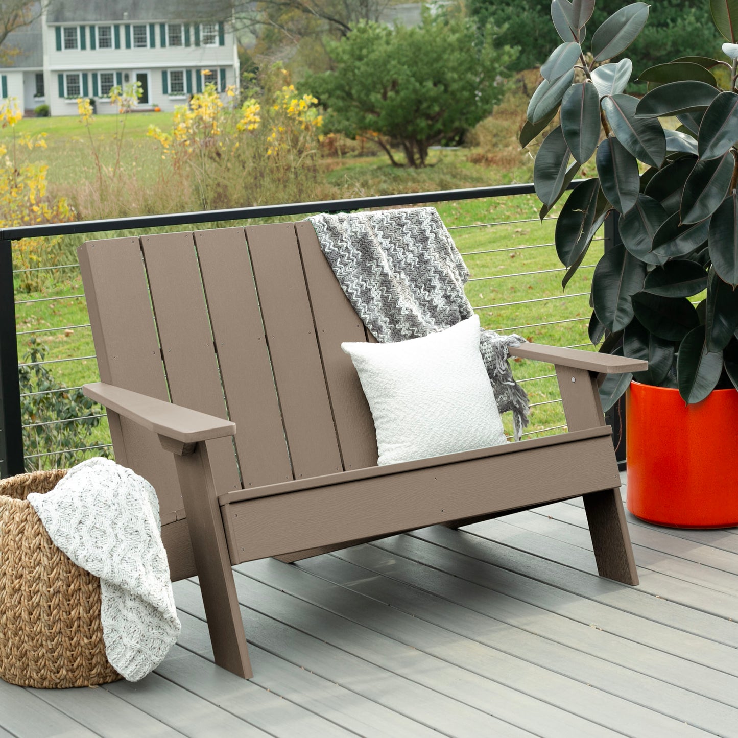 Light brown Granite Hills double wide Adirondack chair with blankets and pillow