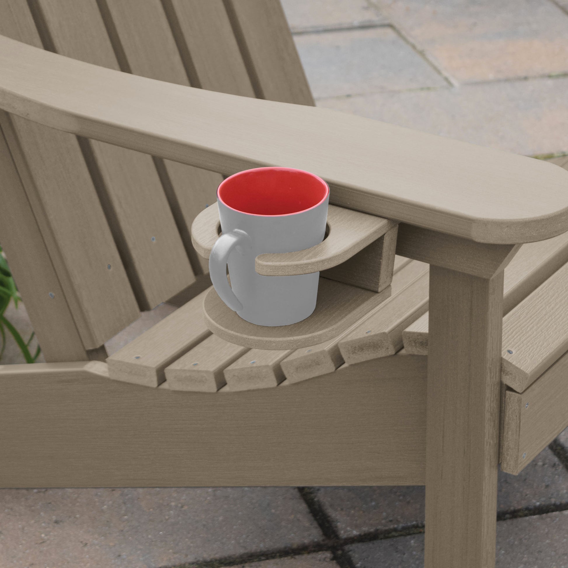 Light brown Adirondack chair and cupholder with mug