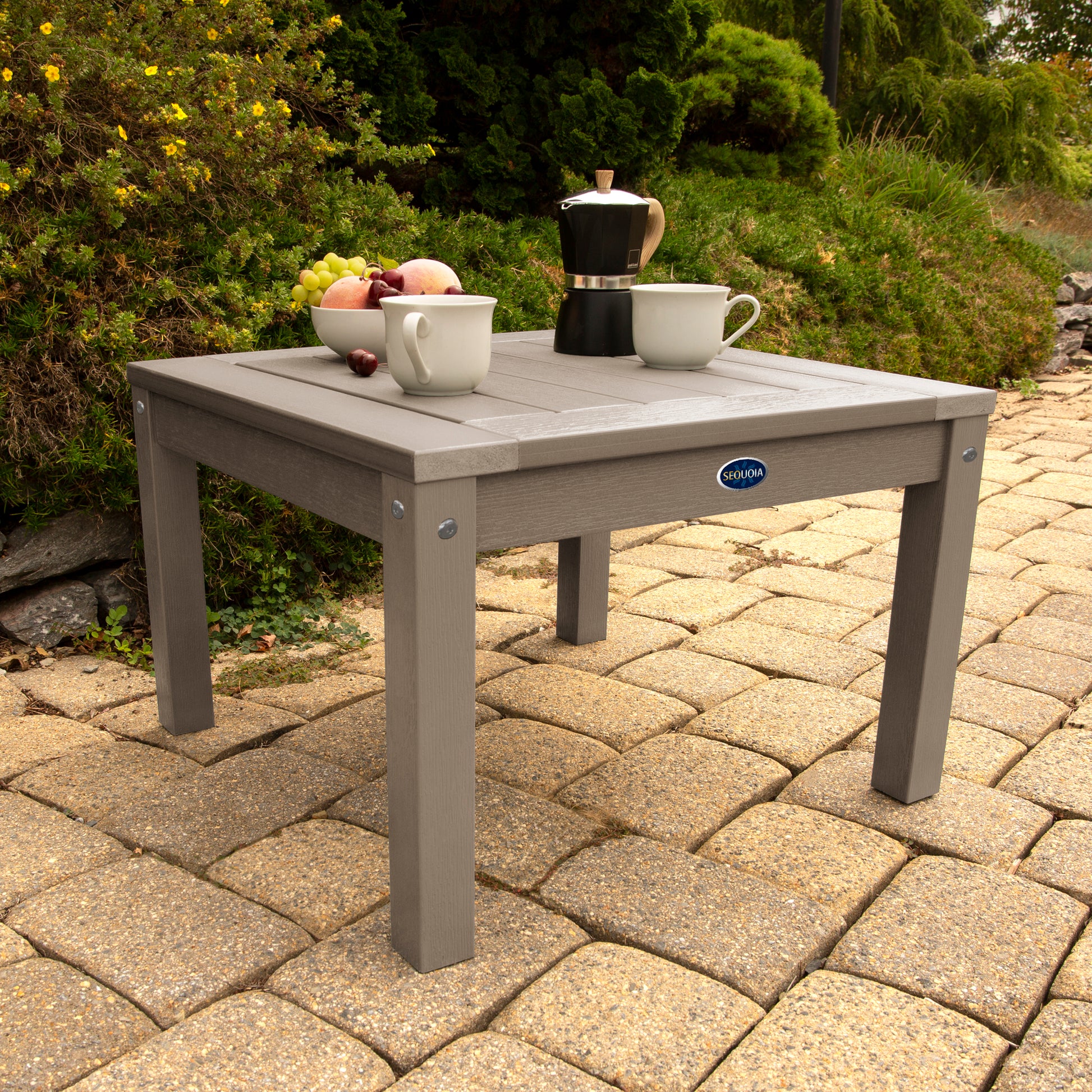 Light brown Adirondack side table with coffee and fruit bowl