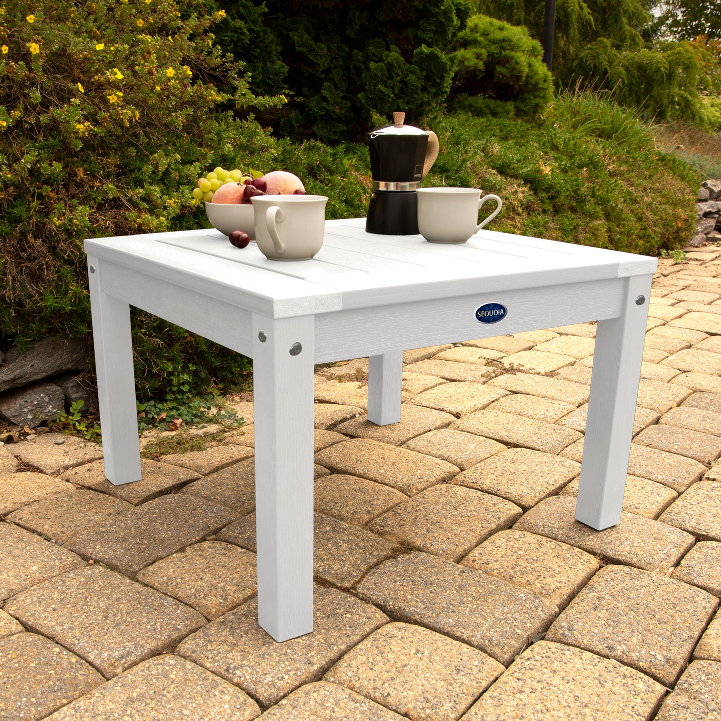 White Adirondack side table with coffee and fruit bowl