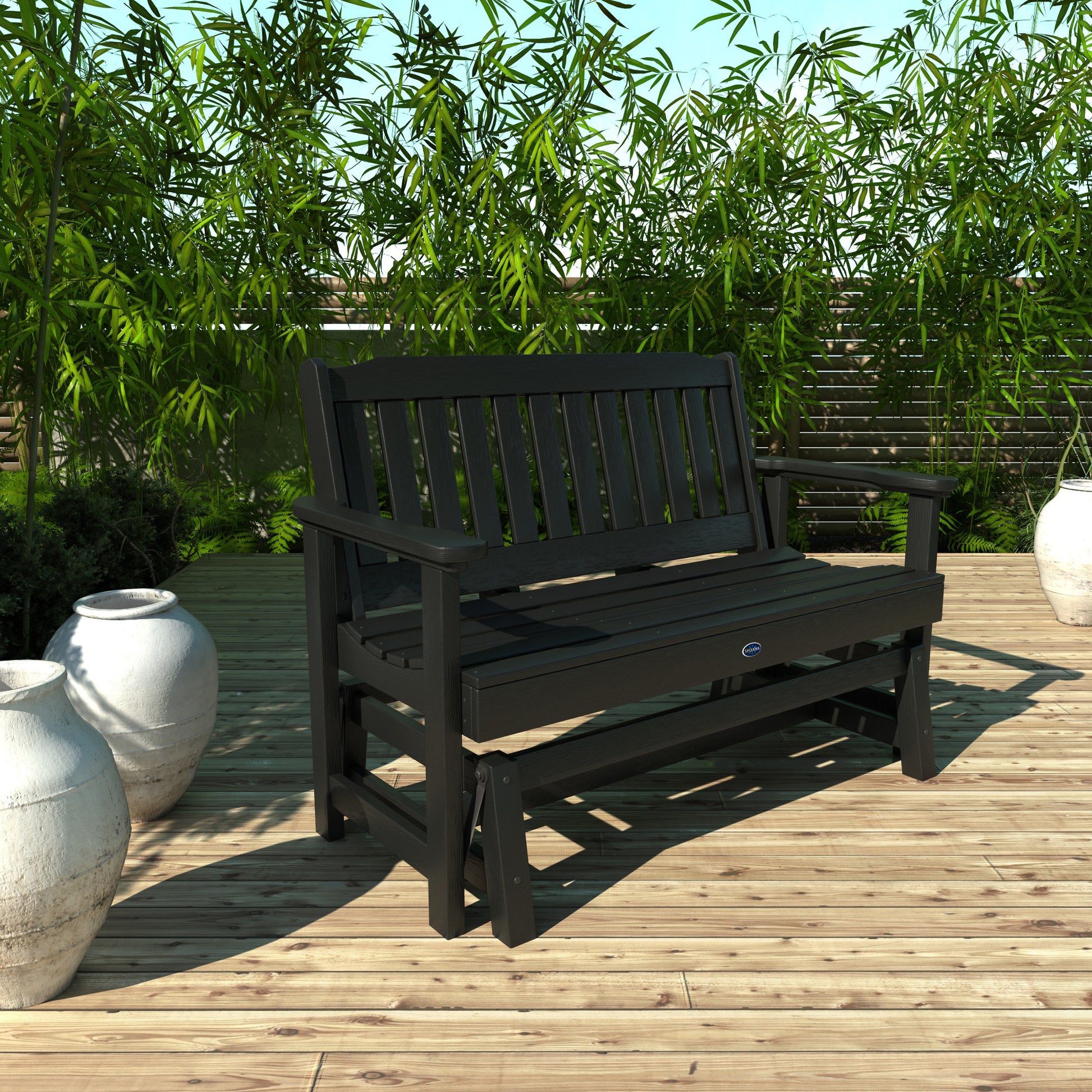 4ft black Blue Ridge glider bench on wooden patio with plants in background