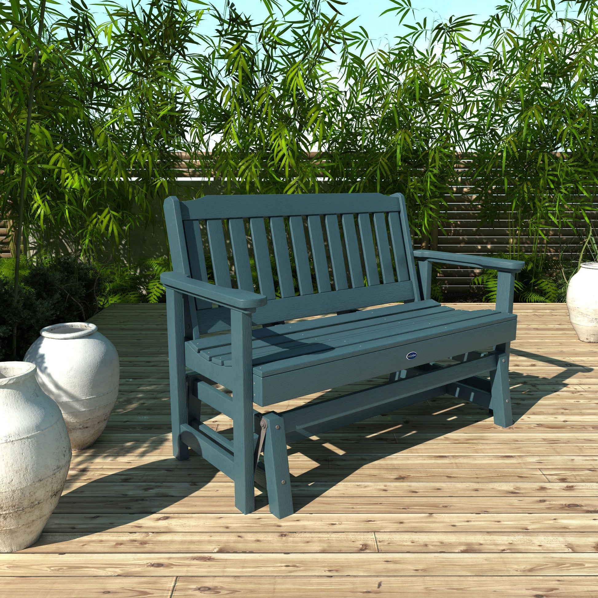 4ft light blue Blue Ridge glider bench on wooden patio with plants in background