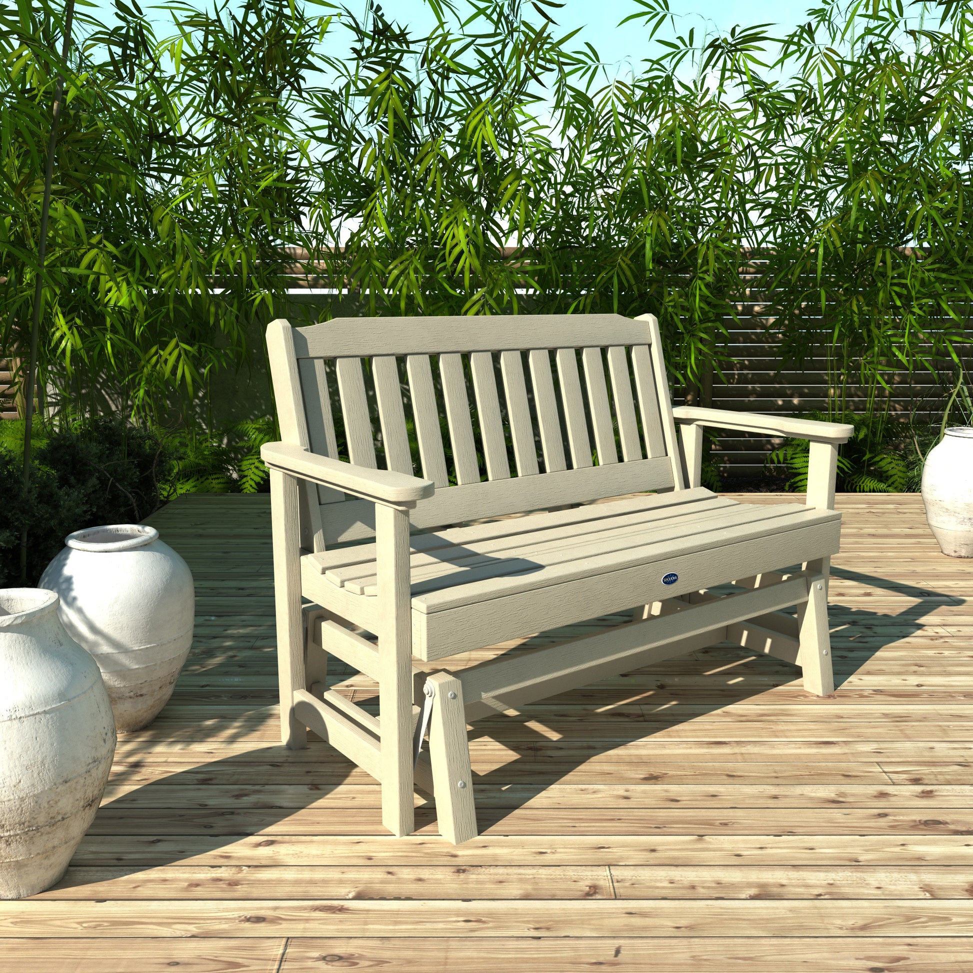 4ft Whitewash Blue Ridge glider bench on wooden patio with plants in background