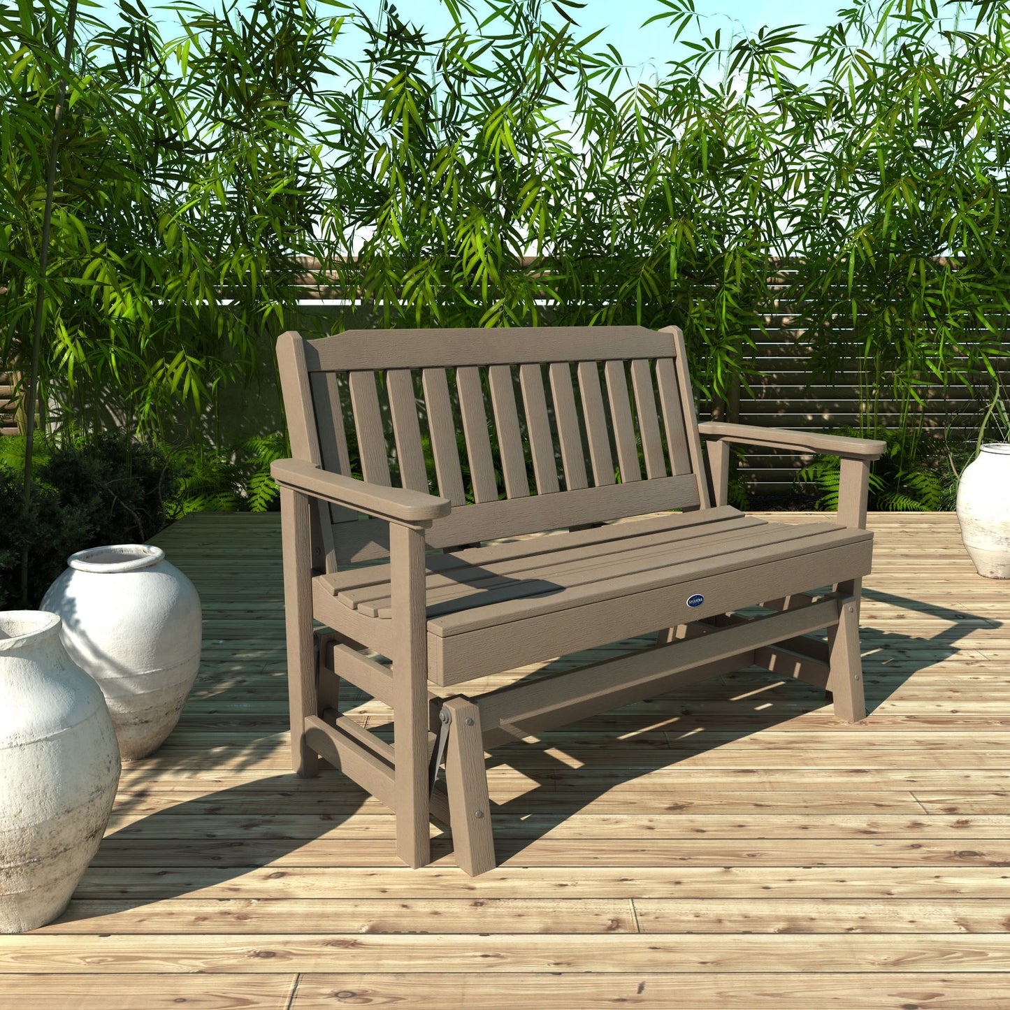 4ft light brown Blue Ridge glider bench on wooden patio with plants in background