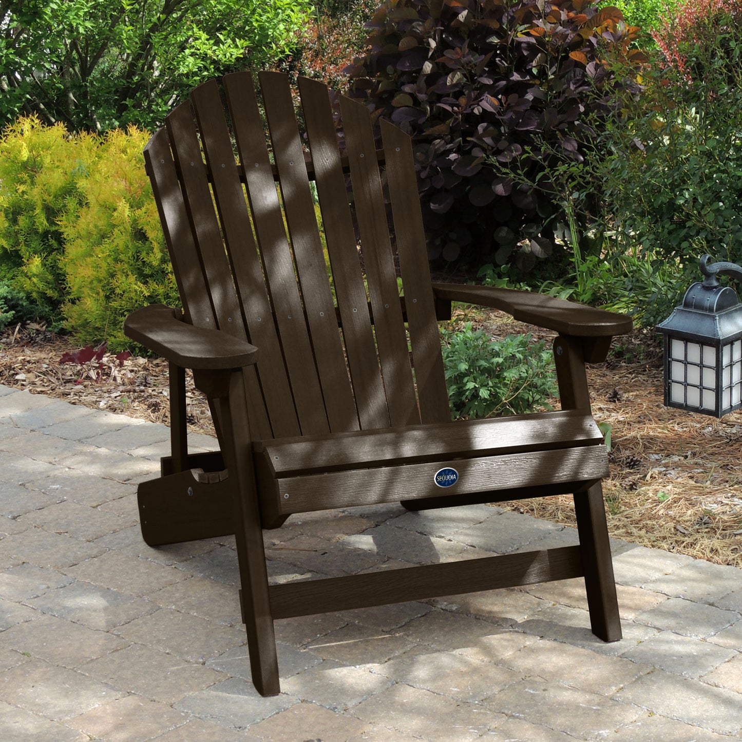 Brown Horizon Adirondack chair on stone with trees in background
