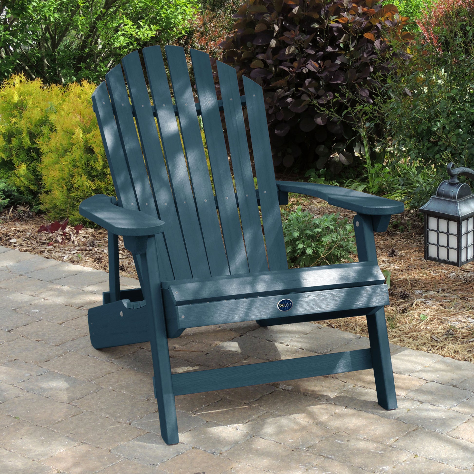 Light blue Horizon Adirondack chair on stone with trees in background