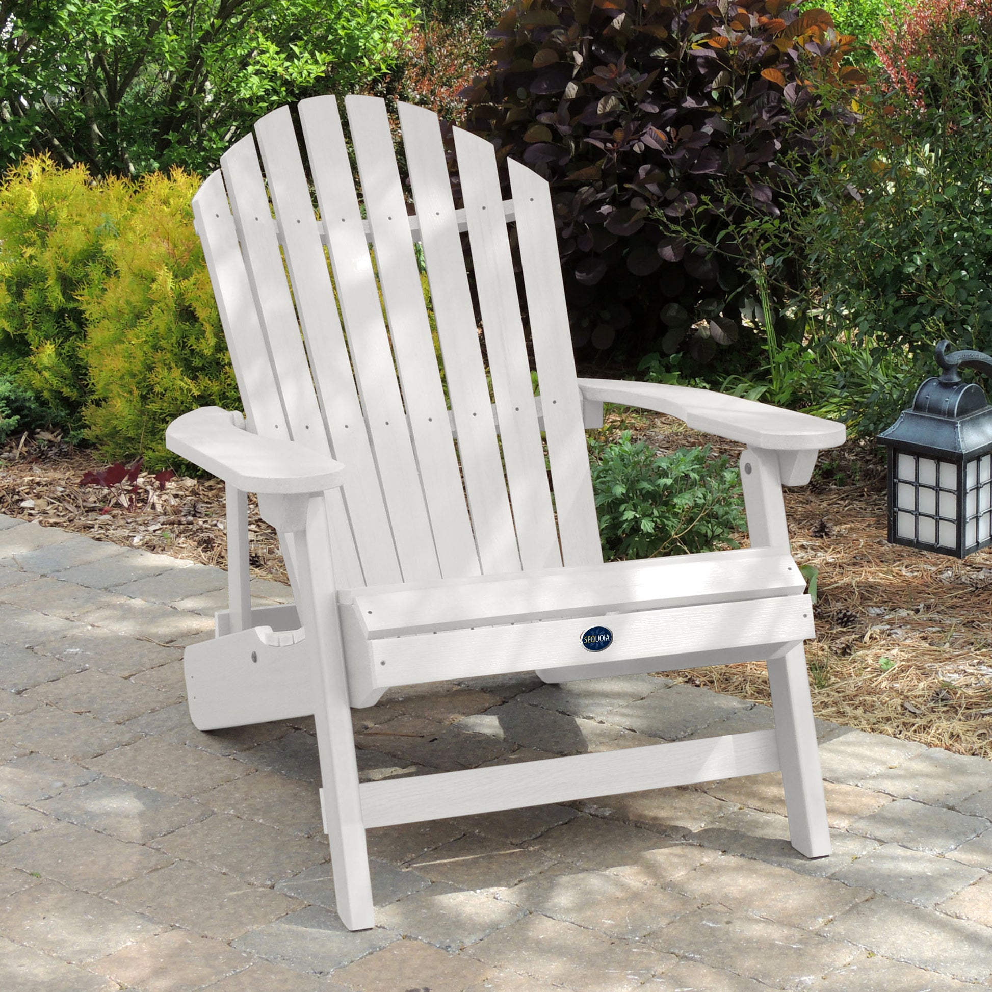 White Horizon Adirondack chair on stone with trees in background