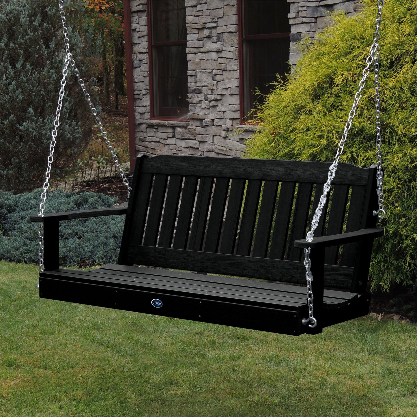 Black 5ft Blue Ridge porch swing with stone house in background