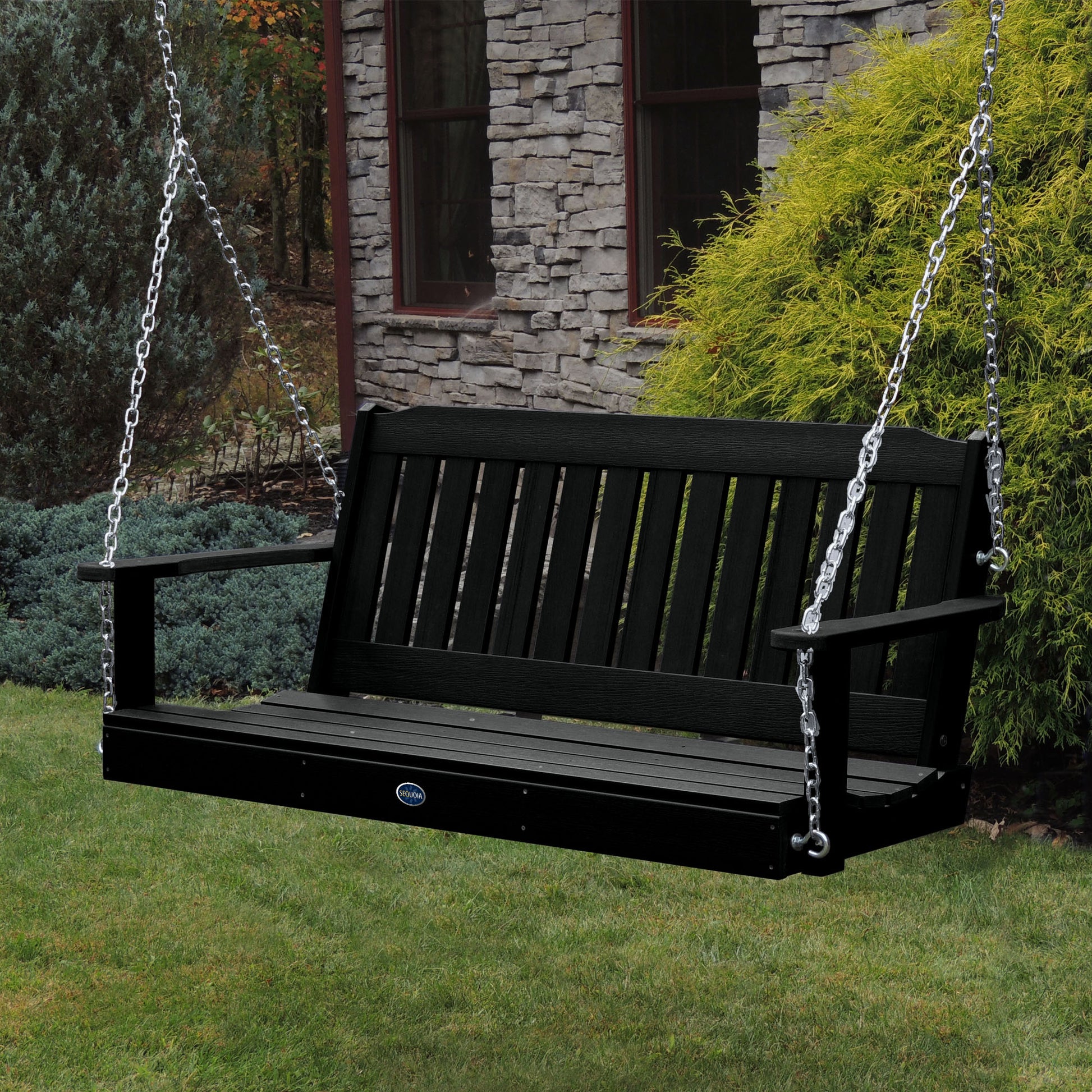 Black 5ft Blue Ridge porch swing with stone house in background