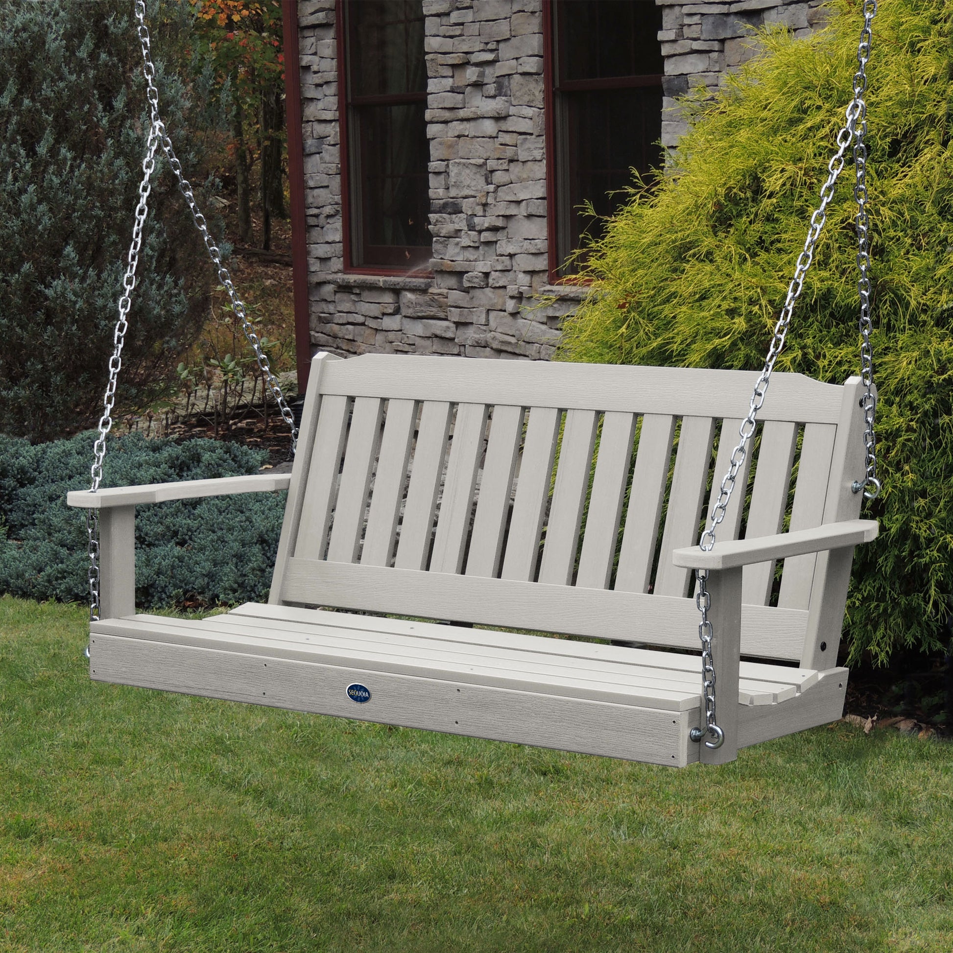 Light gray 5ft Blue Ridge porch swing with stone house in background