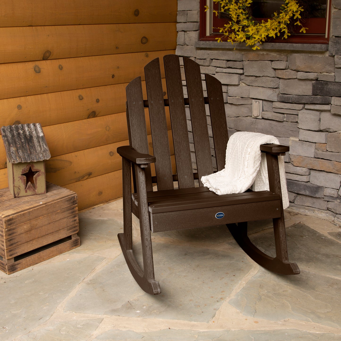 Brown Lighthouse Garden Rocking Chair on porch with blanket