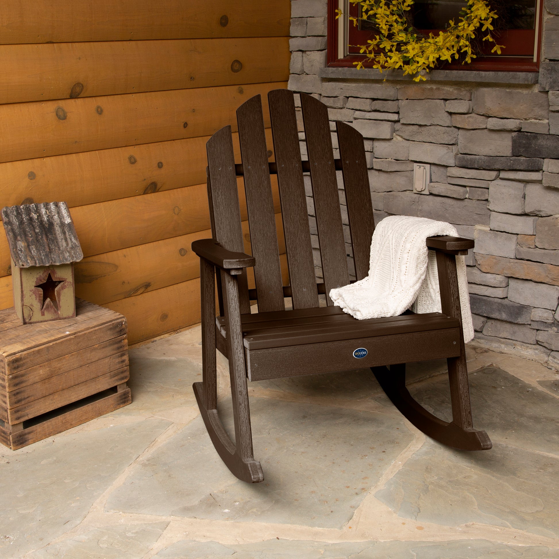 Brown Lighthouse Garden Rocking Chair on porch with blanket