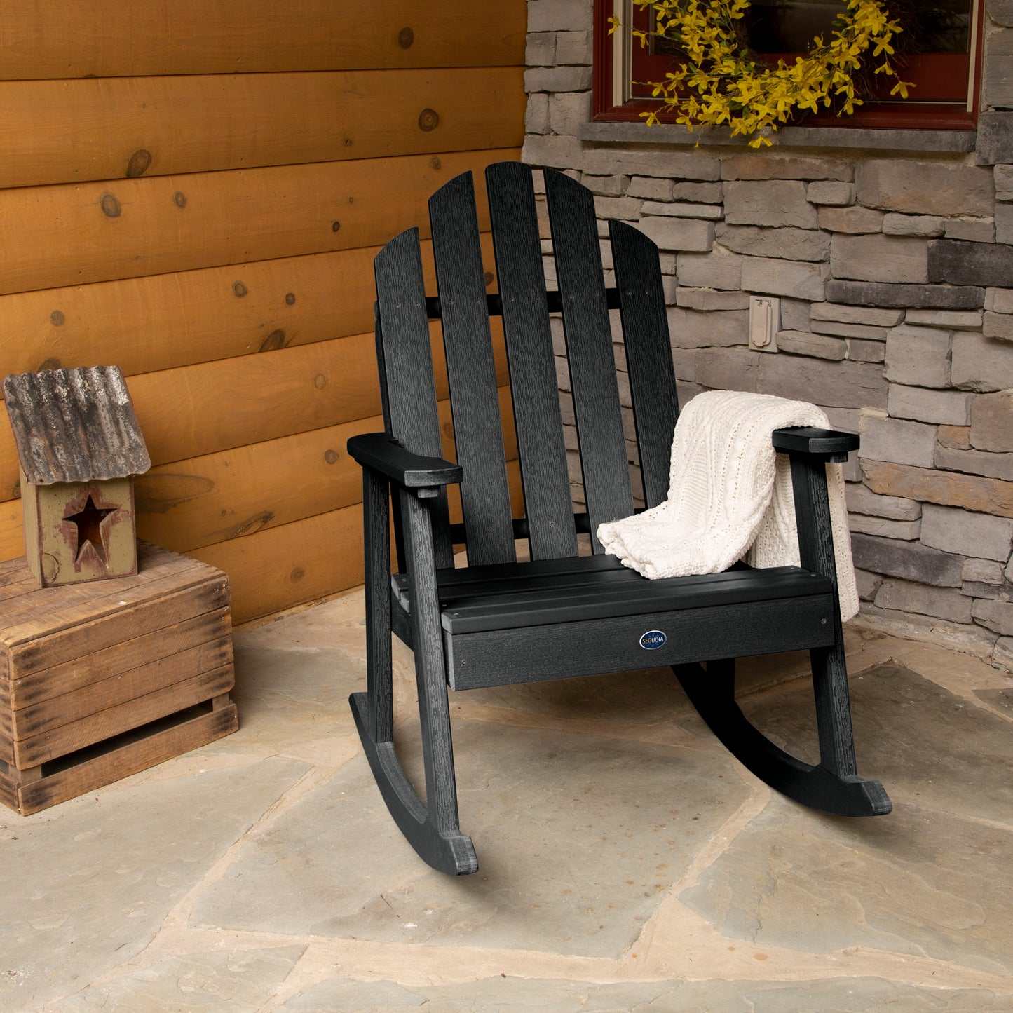 Black Lighthouse Garden Rocking Chair on porch with blanket
