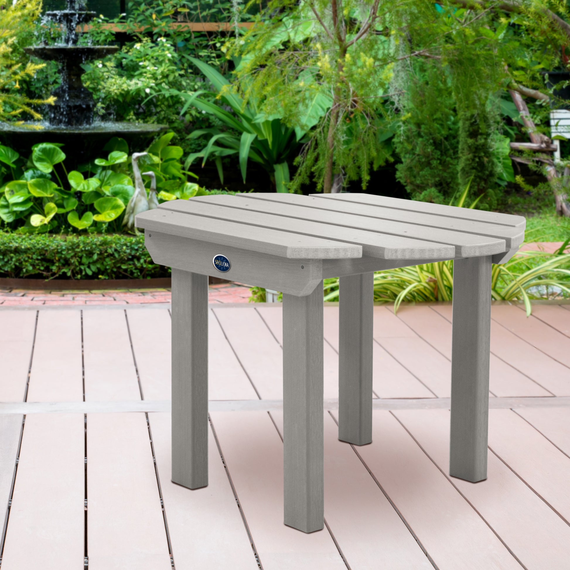 Light gray Lighthouse side table on wooden patio