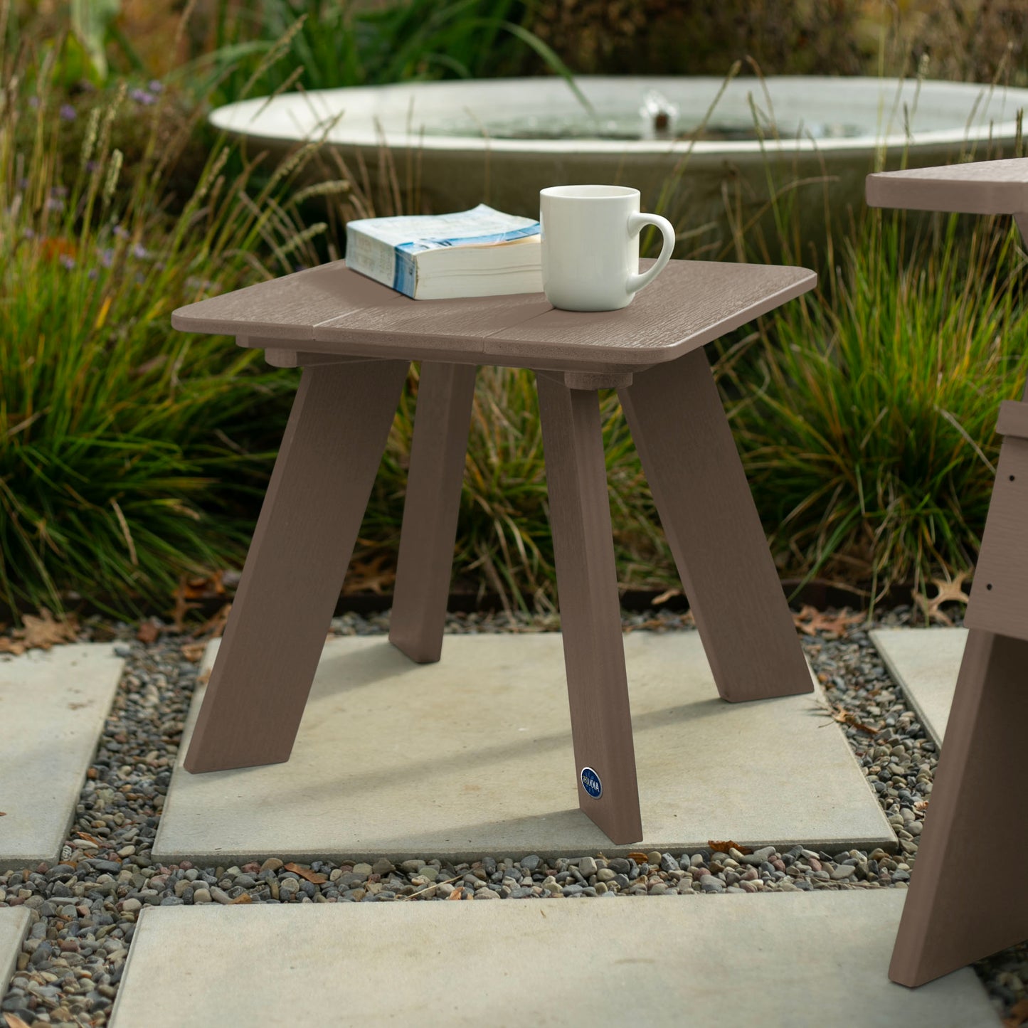 Light brown Granite Hills side table with book and coffee mug