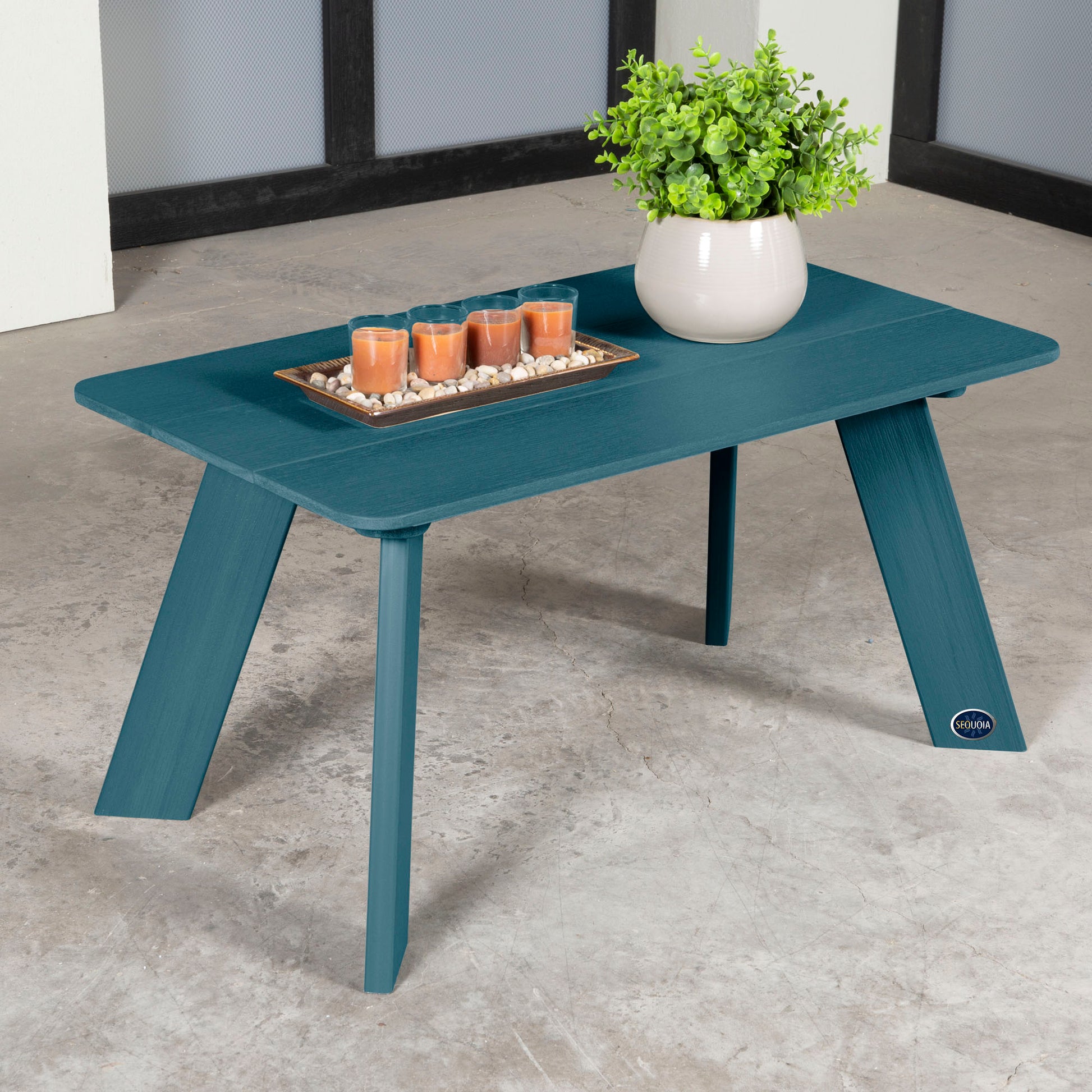 Blue Granite Hills coffee table with candles and plant