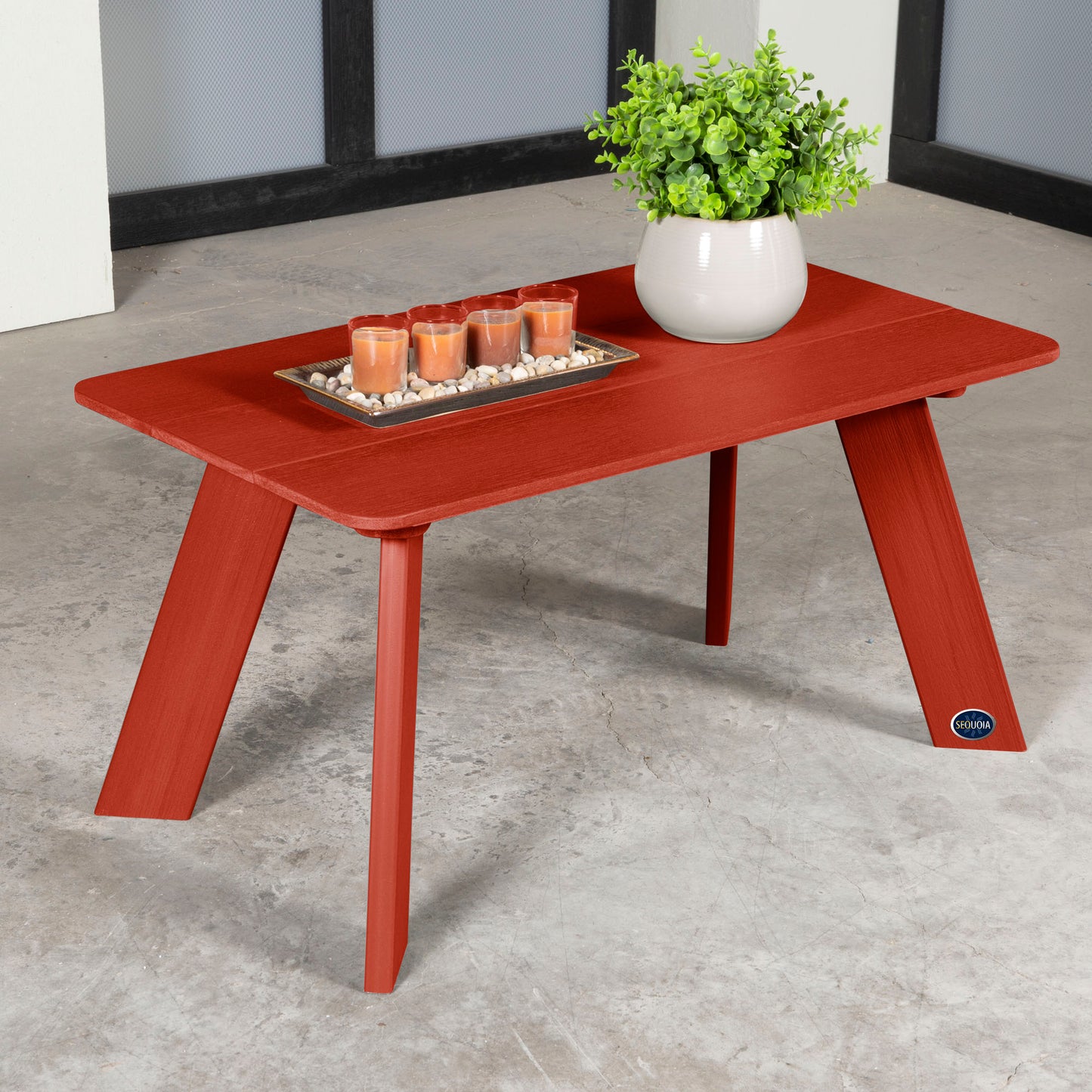 Red Granite Hills coffee table with candles and plant