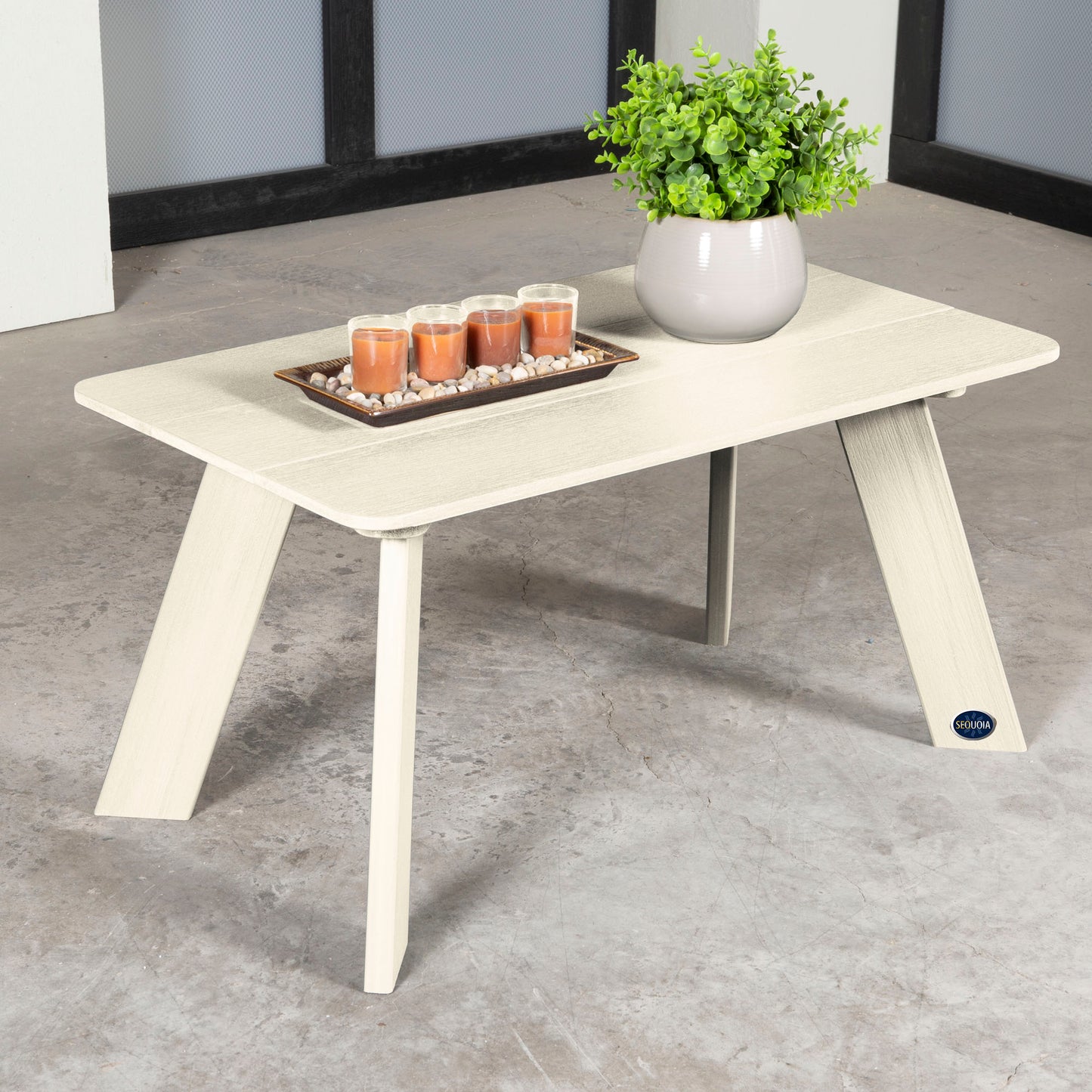 Whitewash Granite Hills coffee table with candles and plant