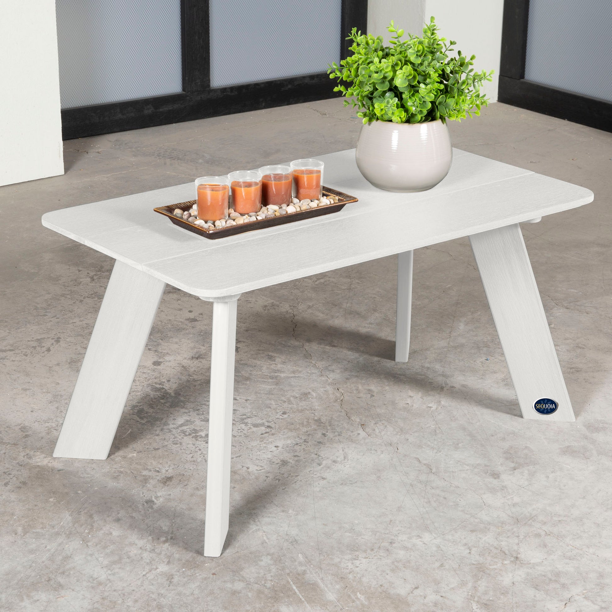 White Granite Hills coffee table with candles and plant