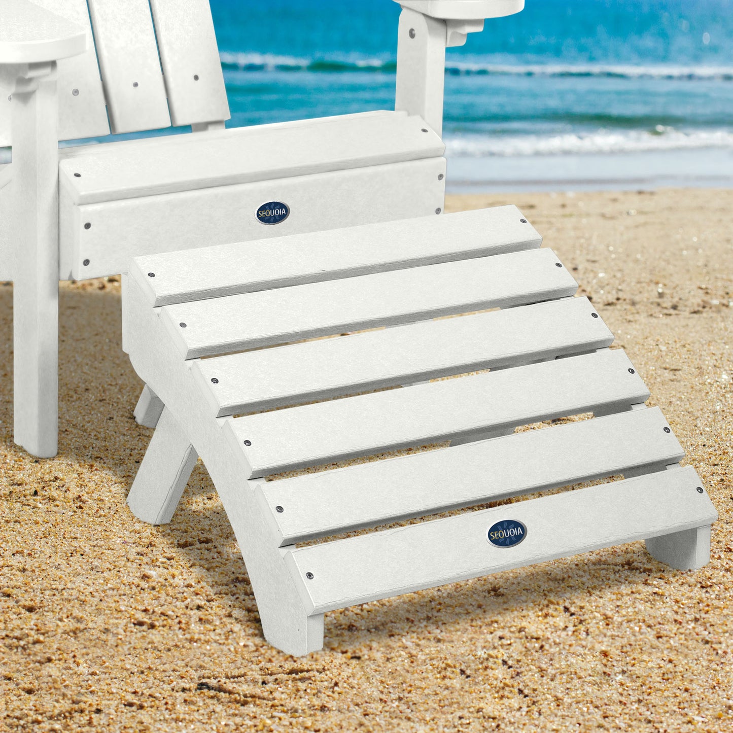 White Sunrise Coast folding ottoman and Adirondack chair on beach