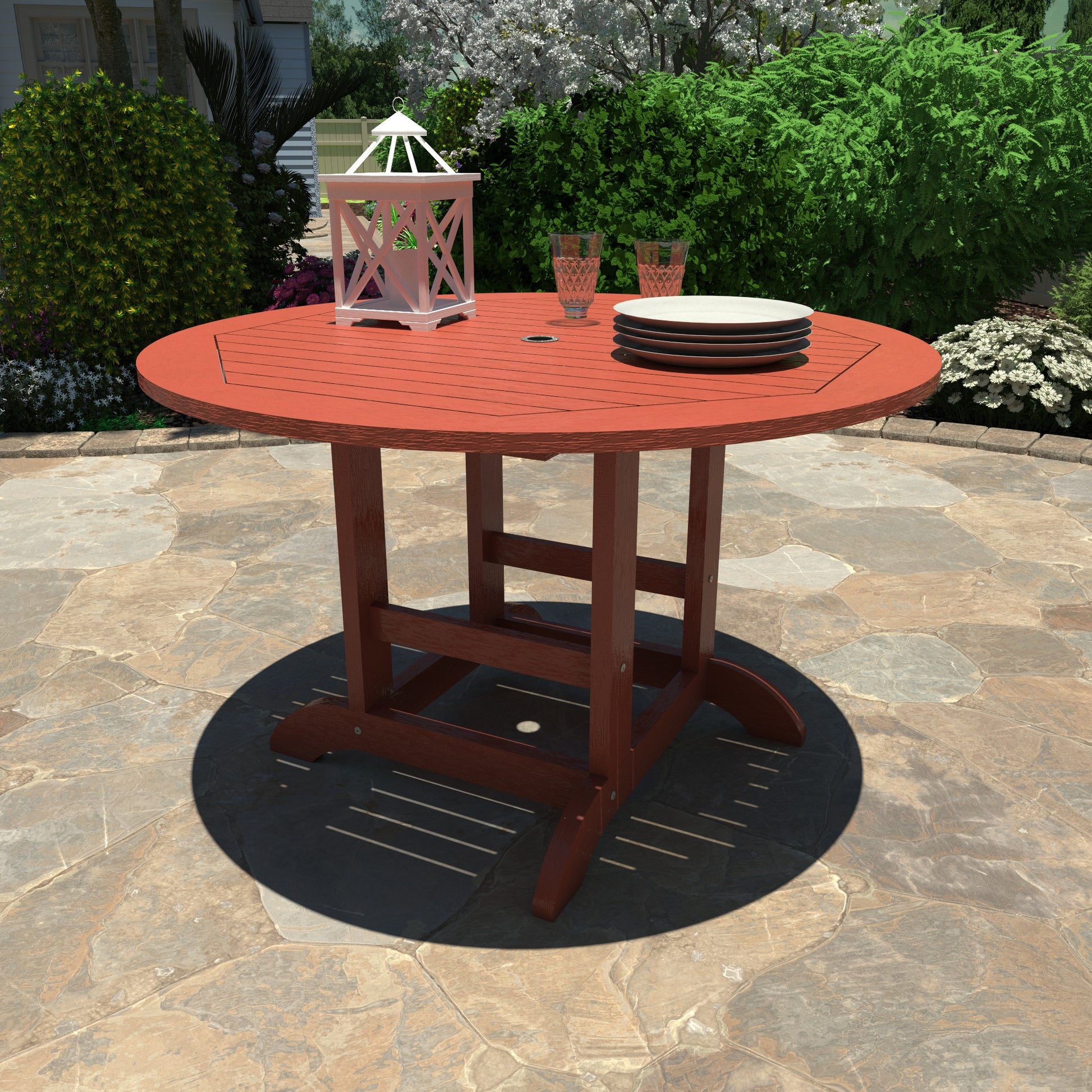 Red 48in diameter dining height table with lantern, plates, and glasses