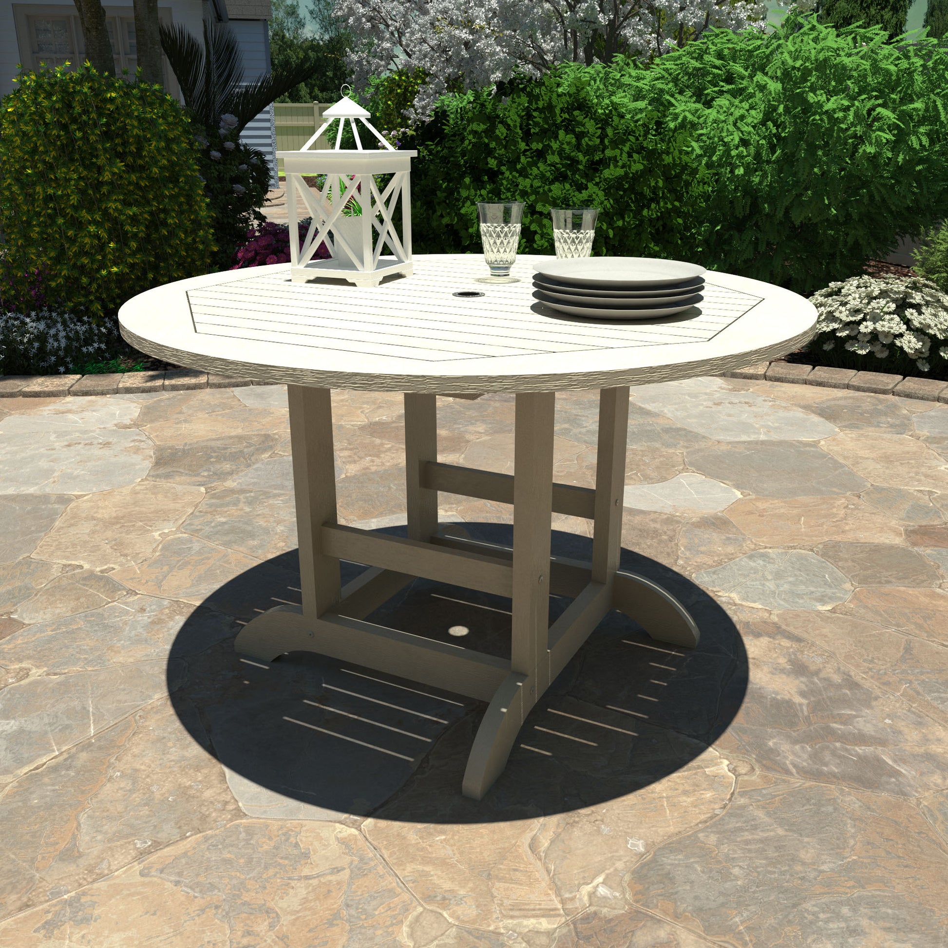 Whitewash 48in diameter dining height table with lantern, plates, and glasses