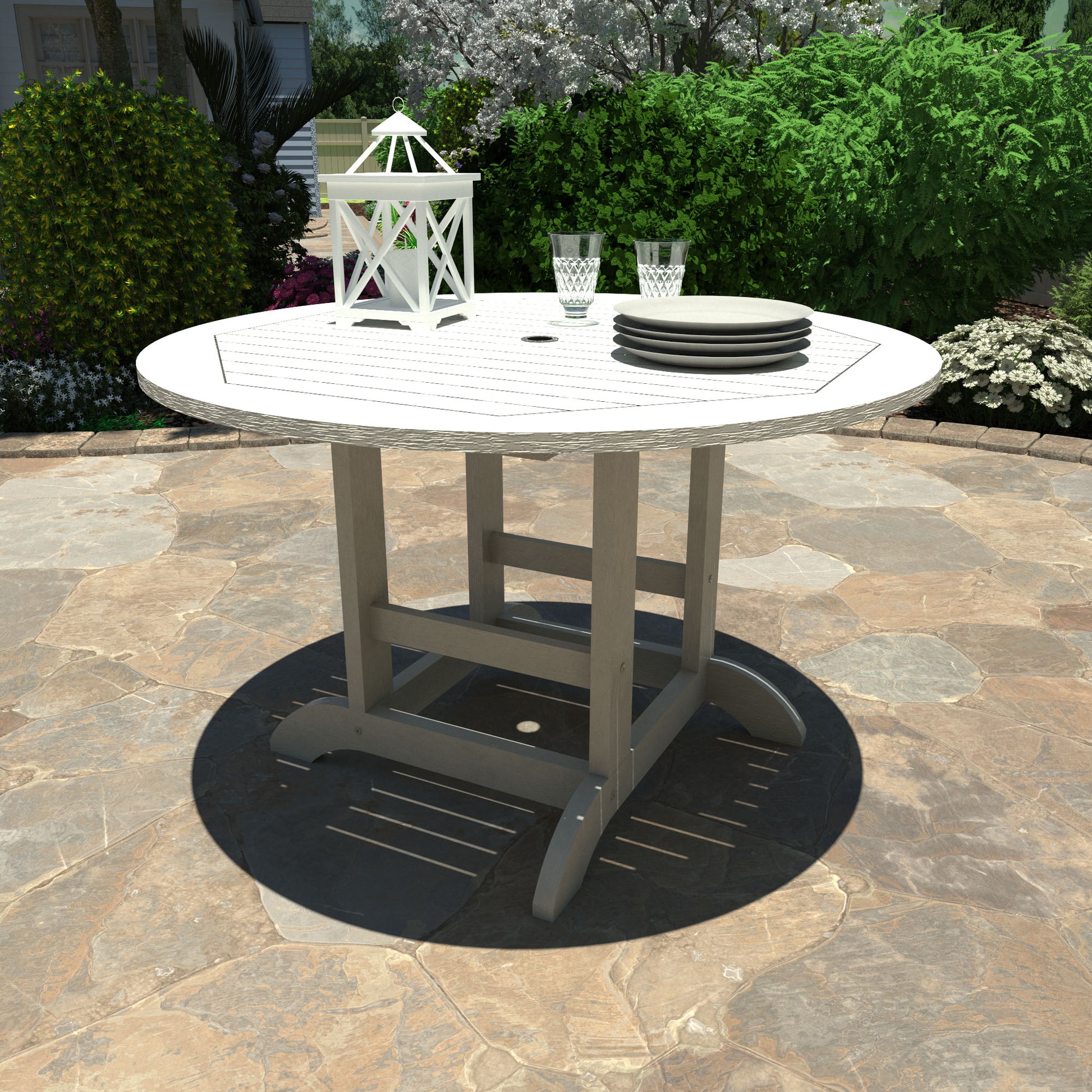 White 48in diameter dining height table with lantern, plates, and glasses