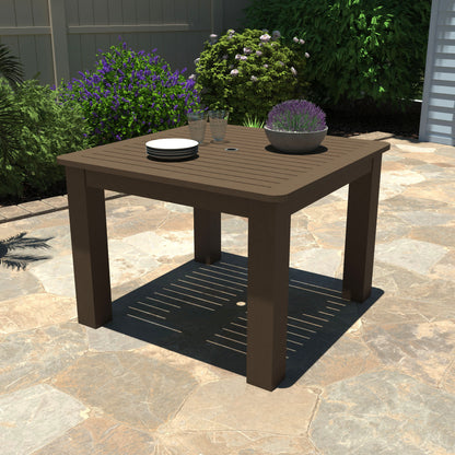 Brown Homestead Square 42x42 table with plates and plant