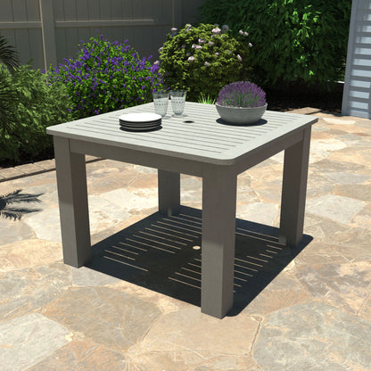 Gray Homestead Square 42x42 table with plates and plant