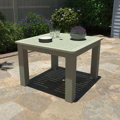 Light green Homestead Square 42x42 table with plates and plant