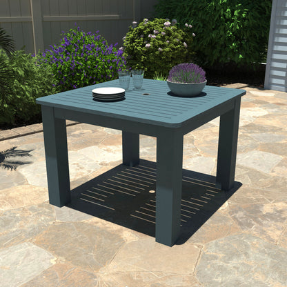 Light blue Homestead Square 42x42 table with plates and plant