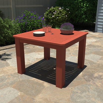 Red Homestead Square 42x42 table with plates and plant