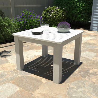 White Homestead Square 42x42 table with plates and plant