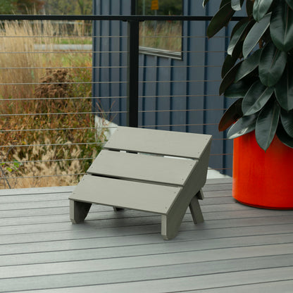 Light green Granite Hills folding ottoman on a deck